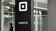 File - A man walks into the building that houses the headquarters of Uber Wednesday, 21 June 2017, in San Francisco. 