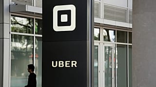 File - A man walks into the building that houses the headquarters of Uber Wednesday, 21 June 2017, in San Francisco. 
