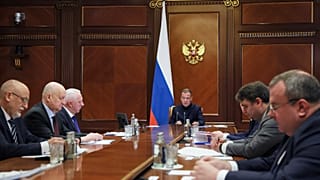 Russian Security Council Deputy Chairman Dmitry Medvedev, center, leads a meeting on countering Western sanctions against Russian companies on Friday, July 31, 2026.