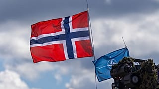 FILE. Norway's and NATO's flags are seen during a military exercise at the Gaiziunai Training Area, Lithuania, 16 May 16 2025