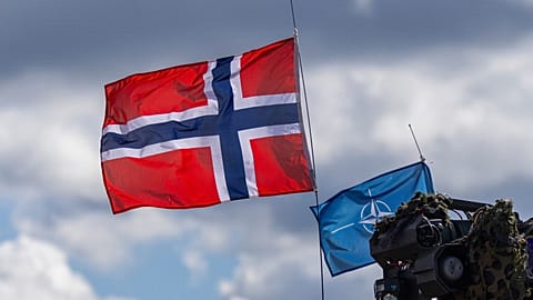 FILE. Norway's and NATO's flags are seen during a military exercise at the Gaiziunai Training Area, Lithuania, 16 May 16 2025