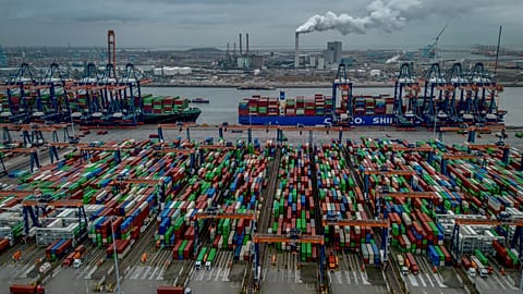 Trucks, containers and cargo ships are pictured at the new Maasvlakte terminal in the harbor of Rotterdam, Netherlands, Tuesday, Dec. 10, 2024.