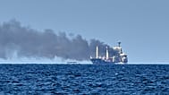 Smoke rises from the grain carrier Golden Leo after Russian missile strike in the Black Sea close to Odesa, Ukraine,