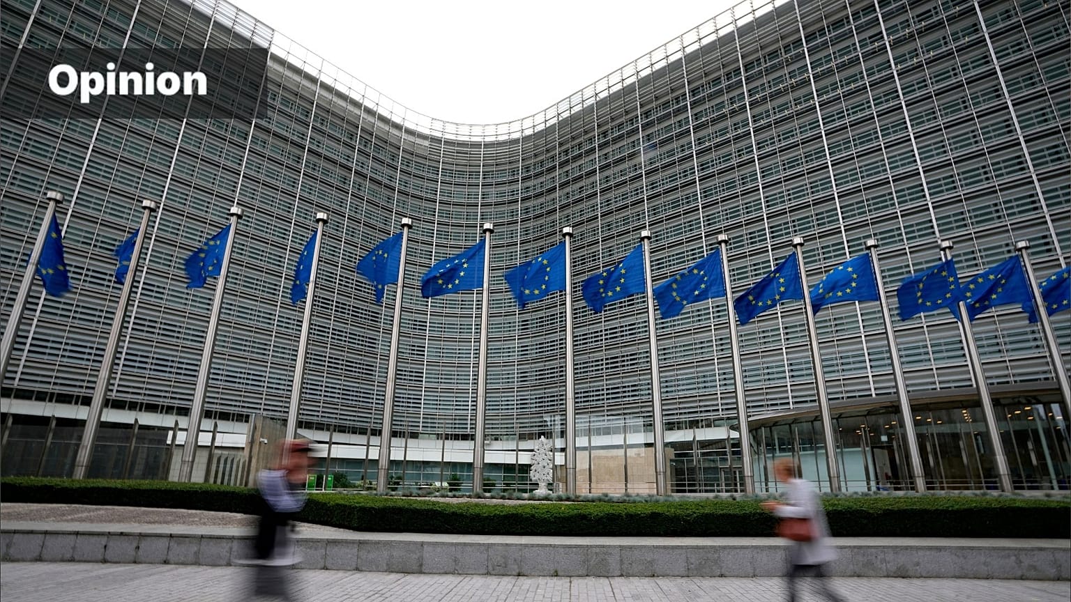 uropean Union flags flap in the wind as pedestrians walk by EU headquarters in Brussels (AP Photo/Virginia Mayo, 
