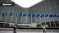uropean Union flags flap in the wind as pedestrians walk by EU headquarters in Brussels (AP Photo/Virginia Mayo, 