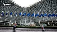 uropean Union flags flap in the wind as pedestrians walk by EU headquarters in Brussels (AP Photo/Virginia Mayo, 