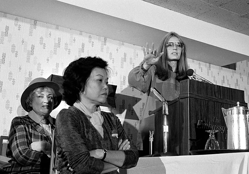 FILE - Bella Abzug and Patsy Mink of Women USA sit next to Gloria Steinem - 21 Nov. 1979