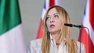 Italian Prime Minister Giorgia Meloni speaks during a press conference at the Federal Chancellery during the E5 summit of leading European nations ahead of the upcoming NATO s