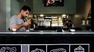 FILE: A man lights his cigarette at a cafe in Tehran, 10 August 2026