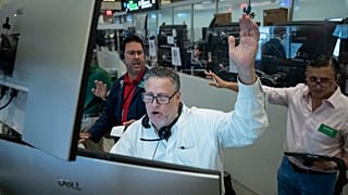 Options trader Marty Handler works on the floor of the New York Stock Exchange, Thursday, Aug. 27, 2026, in New York.