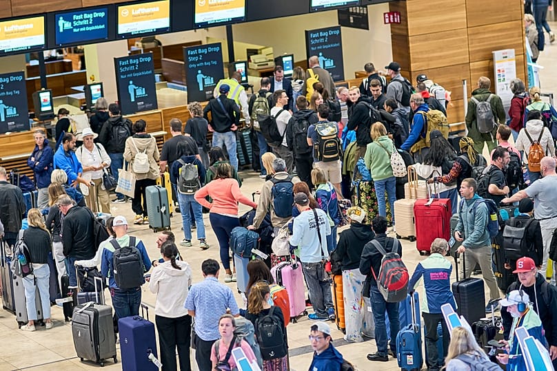 Passengers at check-in counters in Terminal 1 at Berlin Brandenburg Airport, 22 September, 2025
