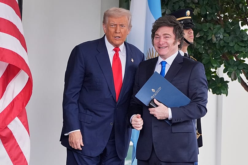 President Donald Trump greets Argentina's President Javier Milei, as he arrives at the White House, Tuesday, Oct. 14, 2025, in Washington.