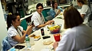 In this Wednesday, Dec. 16, 2020 file photo, Nurse Anne-Catherine Charlier, center, talks to colleagues during a dinner break in the intensive care ward for COVID-19 patients 