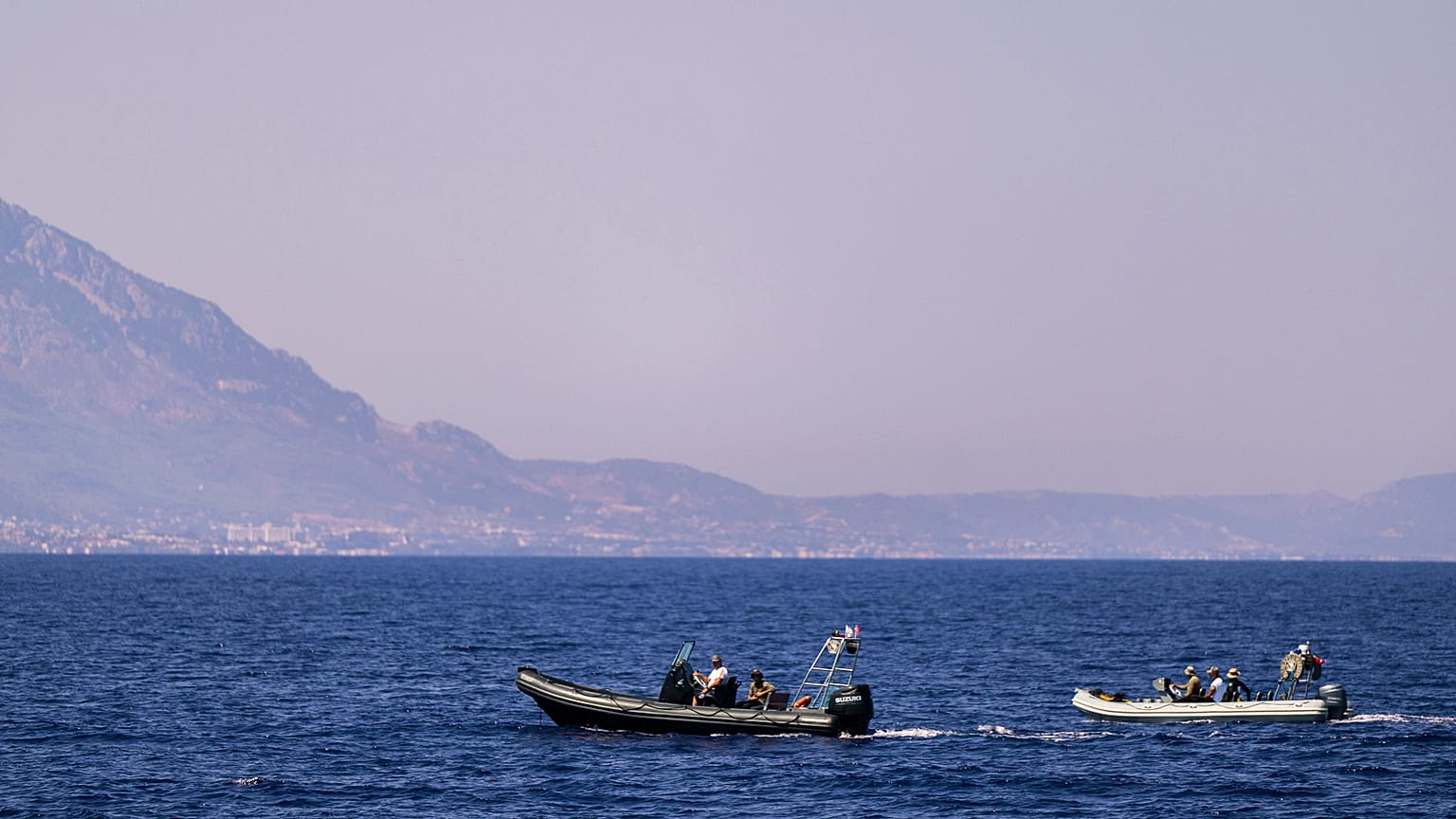 Motor boats take part in a search operation for people missing after a ferry disaster off the coast of Cyprus, near the port of Kyrenia.