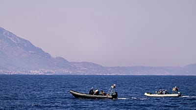 Motor boats take part in a search operation for people missing after a ferry disaster off the coast of Cyprus, near the port of Kyrenia.