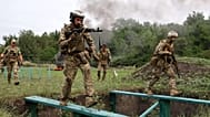 Soldiers practice military skills at a training ground near the frontline in the Zaporizhzhia region, 24 July, 2026