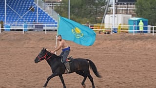Parading the flag of Kazakhstan before the match 
