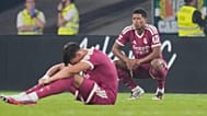 Real Madrid's Jude Bellingham, right, and Carlos Espi react after the Spanish La Liga soccer match between Real Betis and Real Madrid in Seville