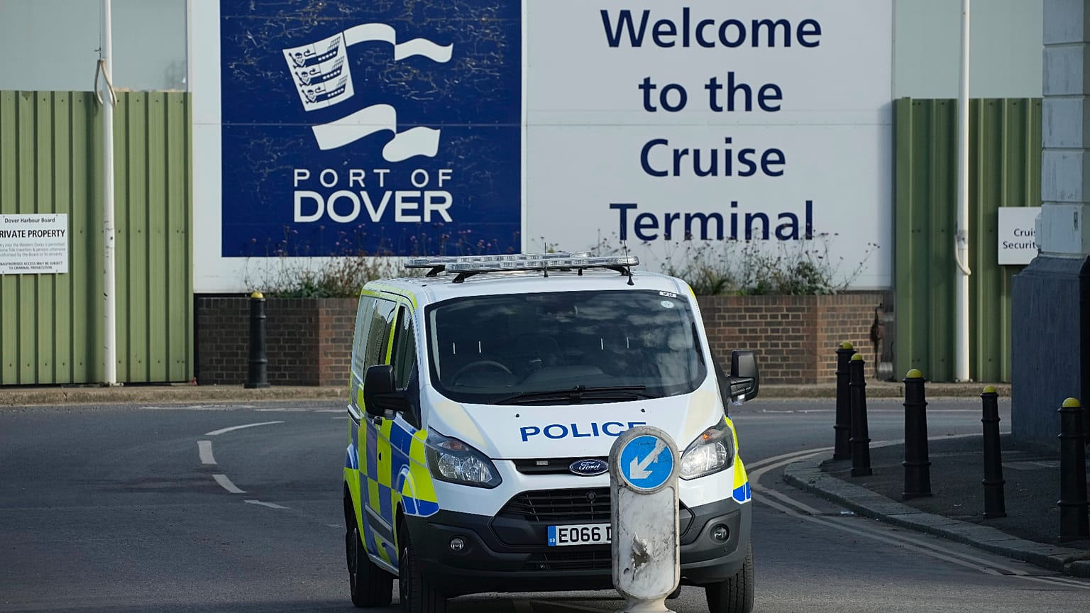 A police van parked outside the migrant processing centre in Dover, England, Monday, Oct. 31, 2022.