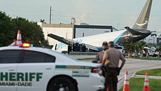 An Amazon cargo plane sits at the Miami International Airport (MIA) after it overshot the runway, Sunday, Sept. 6, 2026. (AP Photo/Lynne Sladky)