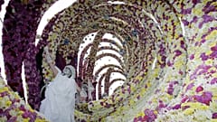 A flower sculpture featuring a giant wave appears during the flower parade in southern Netherlands, on Sept. 11, 2005. 