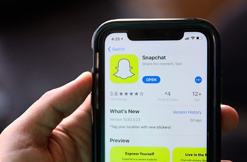 The introduction page for Snapchat shown in a mobile phone displayed at Apple's App Store in Chicago, 30 July, 2019