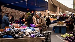People buy goods and food at a street market in Istanbul, Turkey - FILE PHOTO