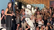 Humanoid robots and robotic pets came together on the runway to dance, perform Tai Chi, do backflips and even the splits.