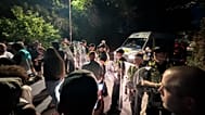 Protestors blocked a road preventing asylum seekers being transported to a processing centre.