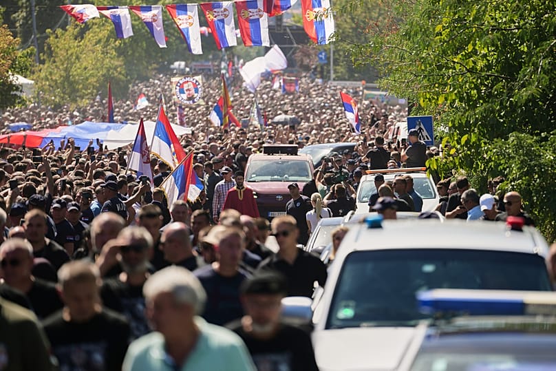 A priest walks in front of a vehicle carrying the coffin of the former Bosnian Serb army commander Ratko Mladic, in Belgrade, 7 September 2026