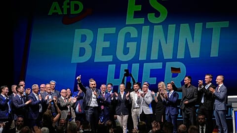 Top AfD candidate Ulrich Siegmund speaks in front of a reading "it starts here" at an election party of the "Alternative for Germany" (AfD) after the Saxony-Anhalt state elect