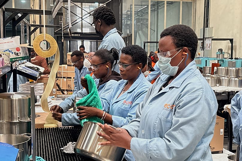 Workers assemble fuel-efficient cookstoves at BURN, a manufacturer of clean cooking appliances, in Kiambu, Kenya, on July 31, 2026. 