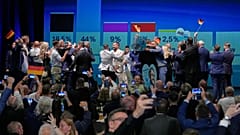 AfD party members celebrate after the first results at an election party of the "Alternative for Germany" (AfD) after the Saxony-Anhalt state elections on Sept. 6, 2026.