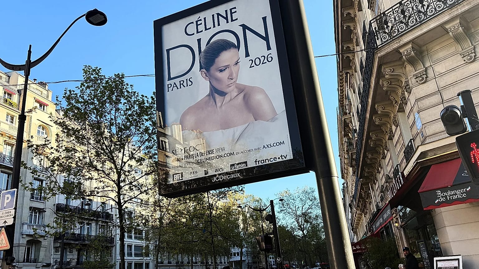 A poster promotes Céline Dion's autumn concerts in Paris, France