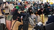 People wait as flights are disrupted due to the eruption of Mount Anak Krakatau, at Soekarno-Hatta International Airport in Tangerang, Indonesia, Monday, Sept. 7, 2026.
