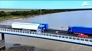Trucks crossing the new bridge, inaugurated on 7 september 2026, linking russia and north korea.