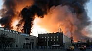 A rescue worker puts out a fire of a building destroyed after a Russian missile attack in Kyiv, 8 September, 2026
