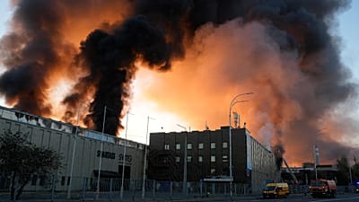 A rescue worker puts out a fire of a building destroyed after a Russian missile attack in Kyiv, 8 September, 2026