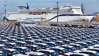 New cars wait to be transported on a dockyard in Yantai in eastern China's Shandong province.