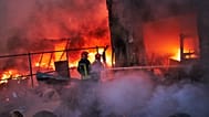 Firefighters try to extinguish a fire following a Russian missile attack in Kyiv, 8 September, 2026