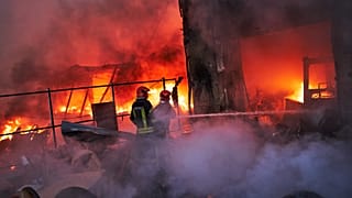 Firefighters try to extinguish a fire following a Russian missile attack in Kyiv, 8 September, 2026