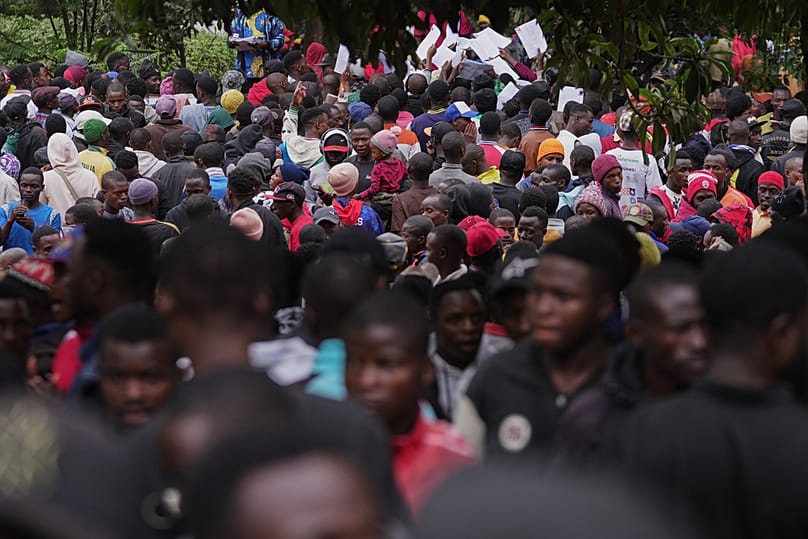 Burundian nationals hold documents outside the Embassy of the Republic of Burundi, in Nairobi, Kenya Tuesday, Sept. 8, 2026. 