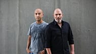 In this Thursday, May 30, 2019 photo, co-creators of Israel's hit TV show "Fauda" Avi Issacharoff, left, and Lior Raz pose for a photo in Tel Aviv, Israel.