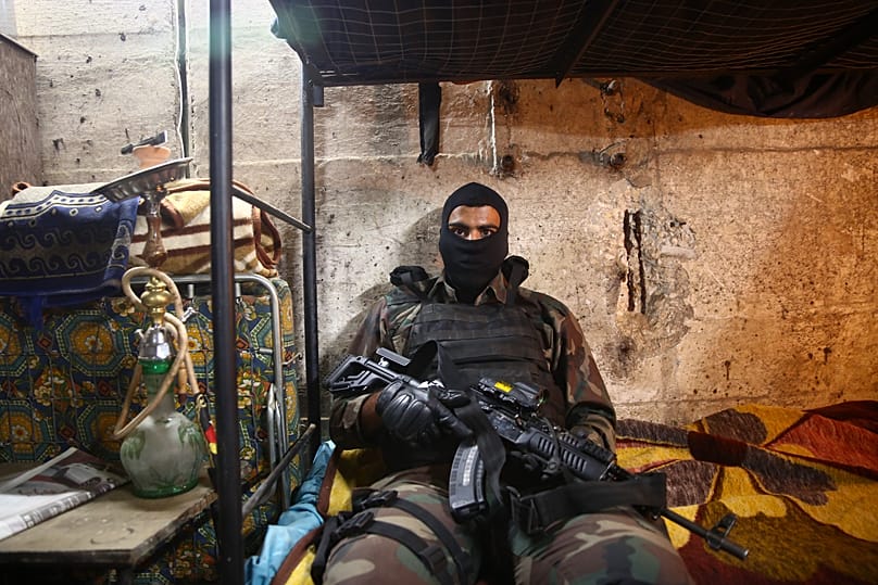 In this Thursday, May 30, 2019 photo, an actor waits for his scene on the set of Israel's hit TV show "Fauda," in Tel Aviv, Israel.