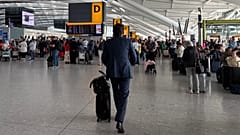 Passengers walk through Terminal 5 of London Heathrow Airport after flights were cancelled because of a technical issue in the air traffic control system, 8 September, 2026