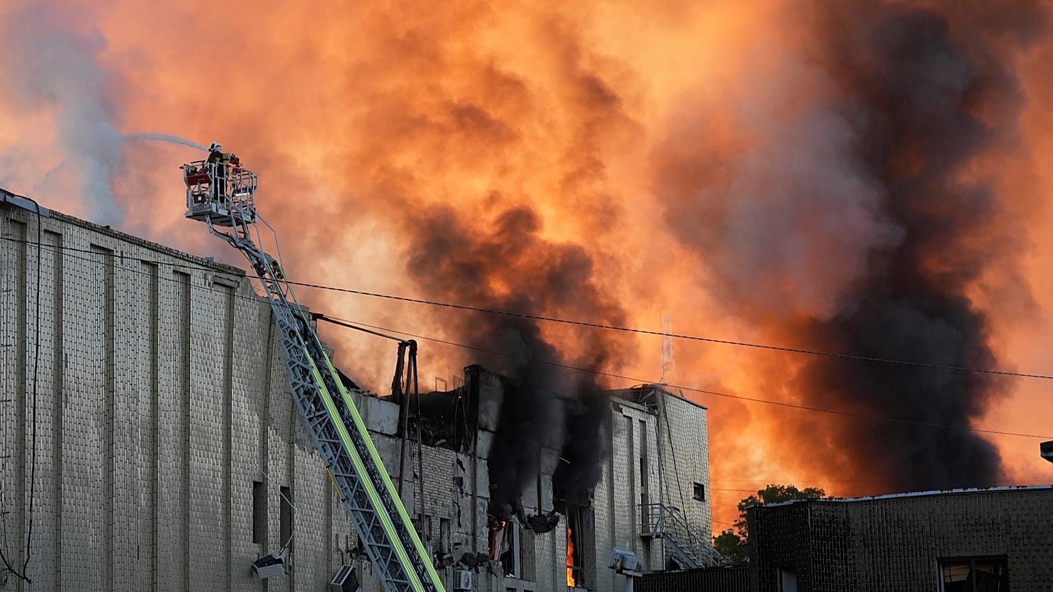 Firefighters put out a fire during Russian massive air attack in Kyiv, 8 September, 2026