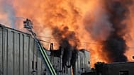 Firefighters put out a fire during Russian massive air attack in Kyiv, 8 September, 2026