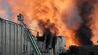 Firefighters put out a fire during Russian massive air attack in Kyiv, 8 September, 2026