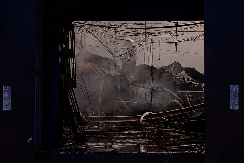 Firefighters work to extinguish a fire in a destroyed household chemical warehouse following a Russian missile and drone attack in Kyiv, 8 September, 2026