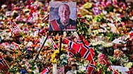 A painting of Norway's late King Harald stands in floral tributes at the Palace Square at the eve of his funeral, in Oslo, Norway, Tuesday, Sept. 8, 2026